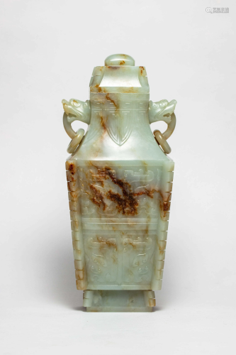 A CHINESE TAOTIE PATTERN JADE VASE ORN…
