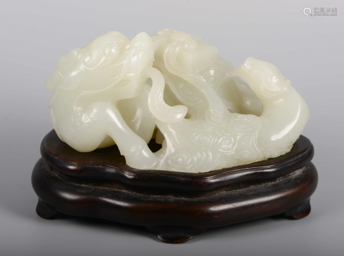 A CHINESE JADE KYLIN ORNAMENT WITH …