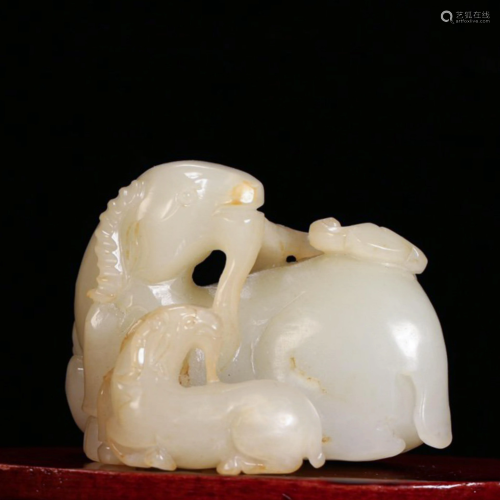 A CHINESE CARVED HETI…
