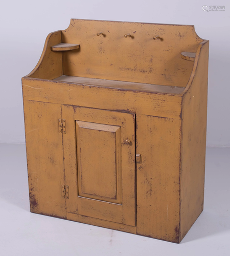 Distressed yellow painted dry sink