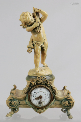 Painted spelter desk clock with cupid finial