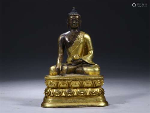 A Chinese Gilded Bronze Medicine Buddha Statue