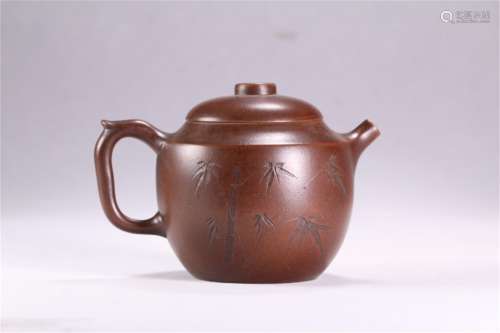 A Chinese Carved Purple Sands Teapot
