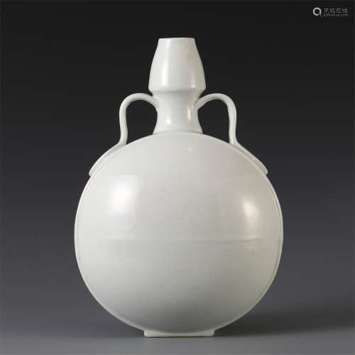 A CHINESE WHITE GLAZED CARVED MOON FLASK VASE