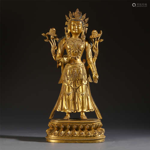 A CHINESE GILT BRONZE STANDING GUANYIN ON LOTUS