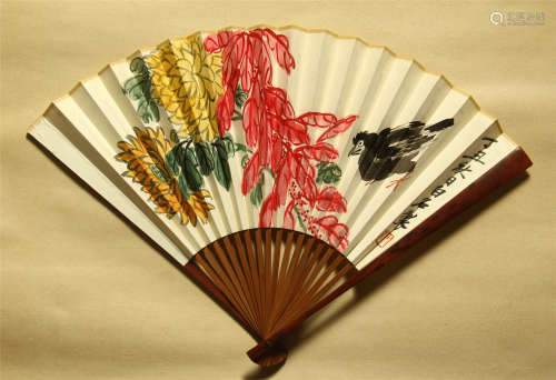A CHINESE PAINTING FAN OF FLOWER AND BIRD WITH CALLIGRAPHY BY QI BAISHI