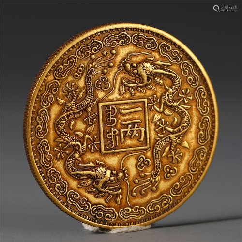 A CHINESE CARVED DOUBLE DRAGON GOLD COIN