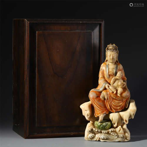 A CHINESE PORCELAIN CARVED SEATED GUANYIN
