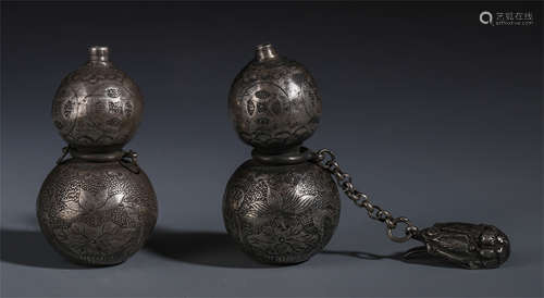 A PAIR OF CHINESE SILVER GOURD BOTTLES