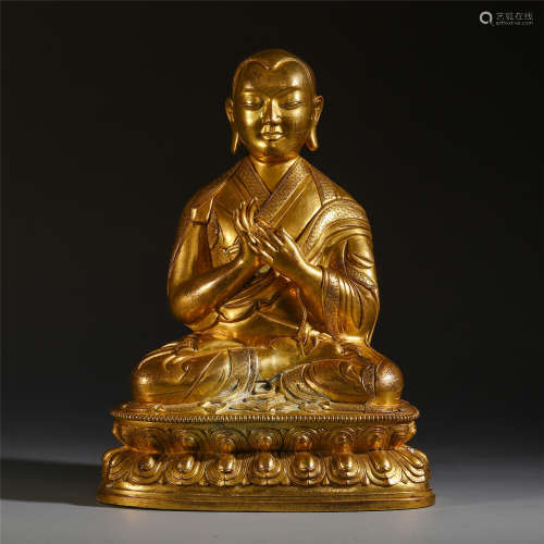 A CHINESE TIBETAN GILT BRONZE GURU SEATED BUDDHIST