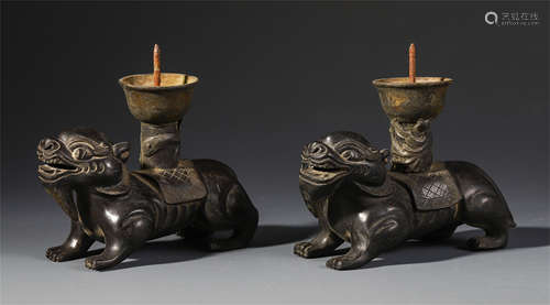 A PAIR OF CHINESE ROSEWOOD CARVED BEAST CANDLE HOLDER