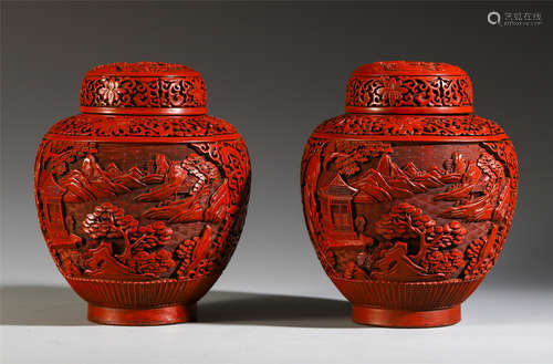 A PAIR OF CHINESE CINNABAR CARVED MOUNTAIN LIDDED VASE