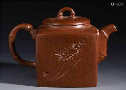 A CHINESE ZISHA CLAY CARVED FLOWER AND POEM TEAPOT