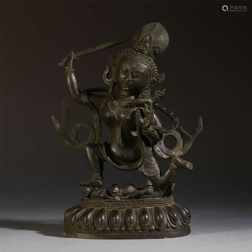 A CHINESE ANCIENT BRONZE SEATED BUDDHIST GUARDIAN ON LOTUS