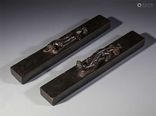 A PAIR OF CHINESE ROSEWOOD CARVED BEAST PAPER WEIGHT