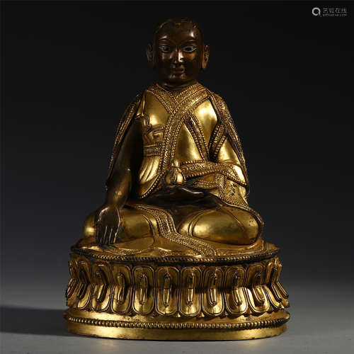 A CHINESE TIBETAN GILT BRONZE SEATED BUDDHIST