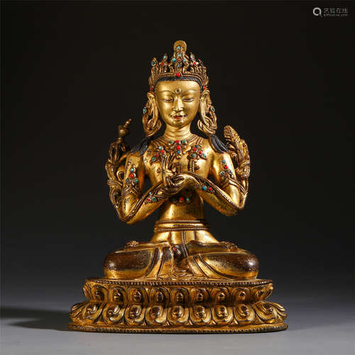 A CHINESE GILT BRONZE GEM STONE INLAID STEATED GUANYIN