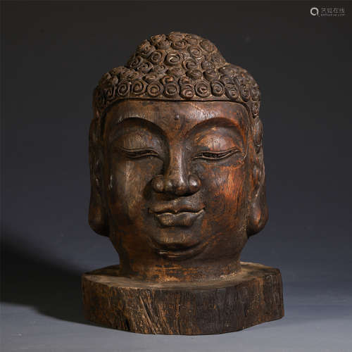 A CHINESE ROSEWOOD CARVED BUDDHA HEAD