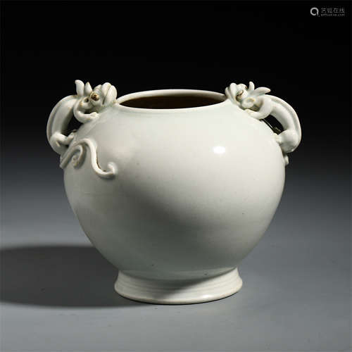 A CHINESE WHITE GLAZED CARVED DOUBLE HANDLE JAR