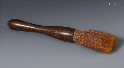 A CHINESE HARDWOOD CARVED BRUSH