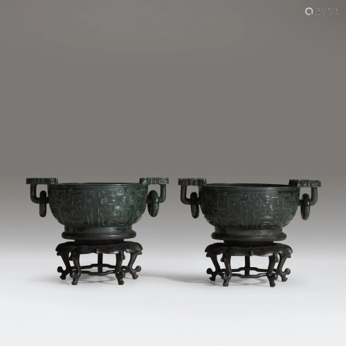 A pair of Chinese carved dark spinach jade…