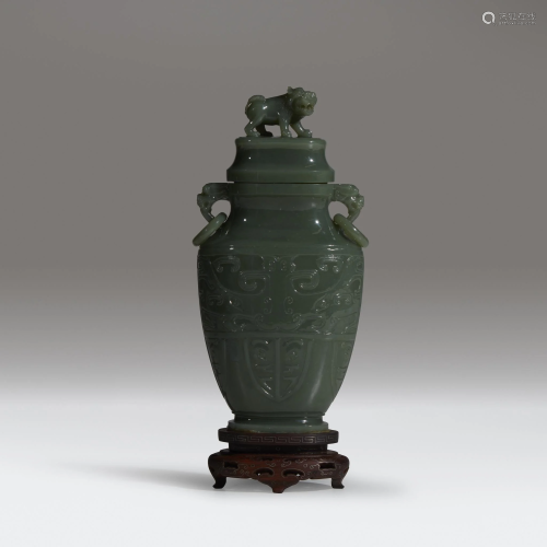 A Chinese carved sage-green jade vase an…