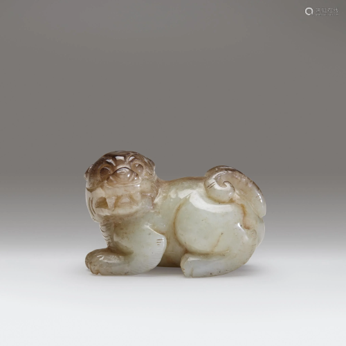 A small Chinese carved celadon and beig…