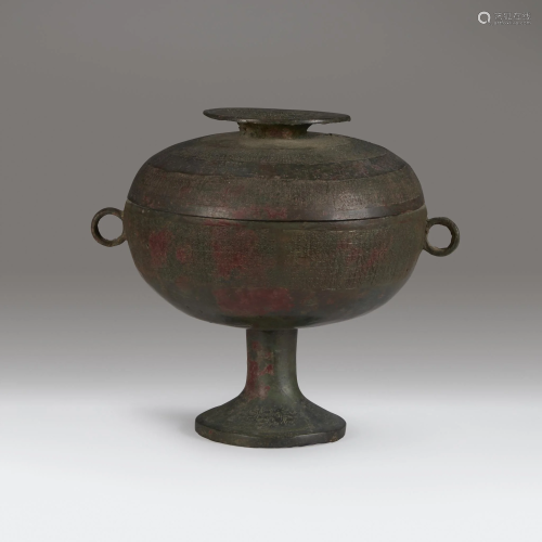 A Chinese archaic bronze ritual vessel and a…