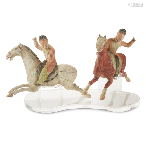 A pair of painted pottery Polo Players, Tang …