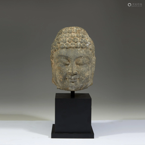 A Chinese carved grey stone head of a Bu…