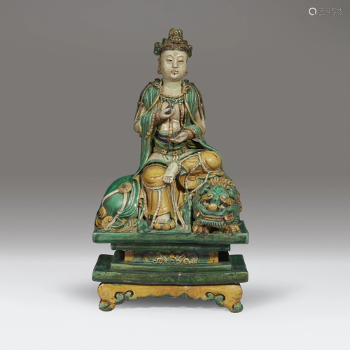 A Chinese sancai-glazed figure of a seate…
