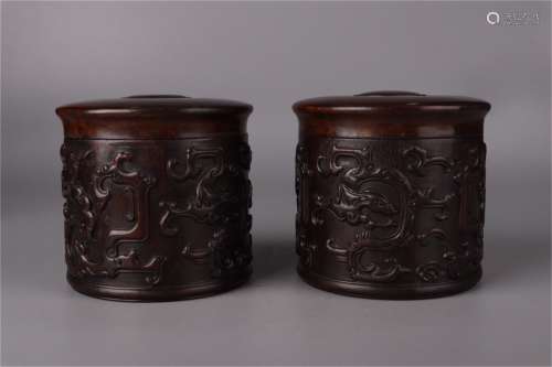 A Pair of Chinese Carved Hardwood Jars with Cover