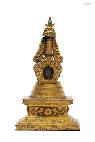 MODEL OF A STUPA IN CHISELLED AND GILDED BRONZE, स…