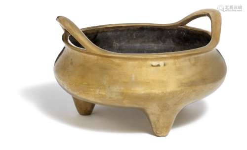 A Chinese tripod bombé-shaped bronze censer with strap handles. Mark of Xuande, but 17th-18th century.