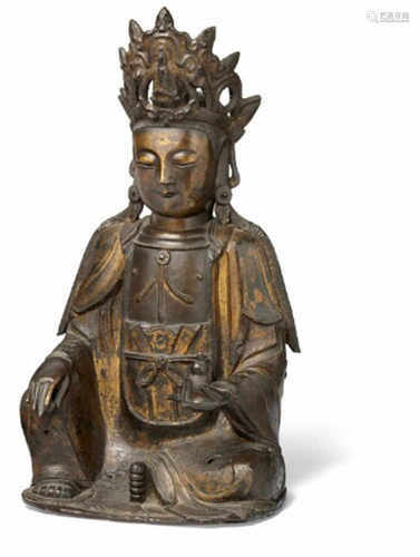 A Chinese bronze and partly gilt figure of Guanyin. Ming 1368-1644. Weight 5570 g. H. 36 cm.