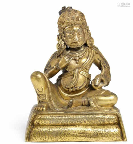 A Chinese gilt bronze figure of Jhambala. C. 1800. Weight 562 g. H. 10 cm.