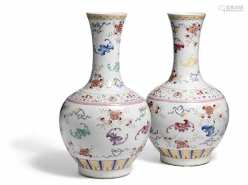 A pair of Chinese famille rose ‘bat and shou’ porcelain vases. Marked Qianlong, but 19th century. H. 44 cm. (2)