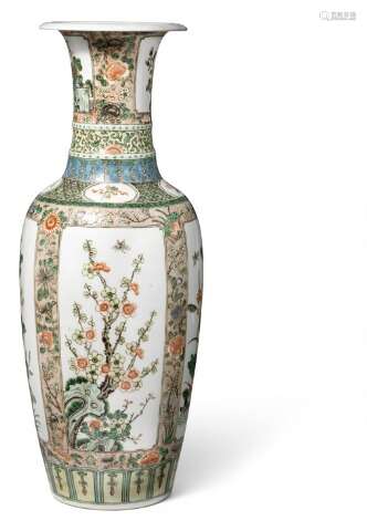 A Chinese famille verte porcelain baluster vase painted with flowers in panels. Mark of Kangxi but 19th century. H. 59 cm.