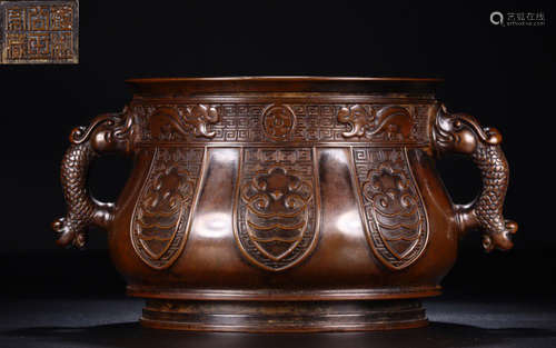 A COPPER CARVED CENSER WITH FISH EAR