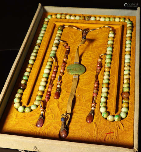 A JADEITE CARVED NECKLACE WITH 108 BEADS