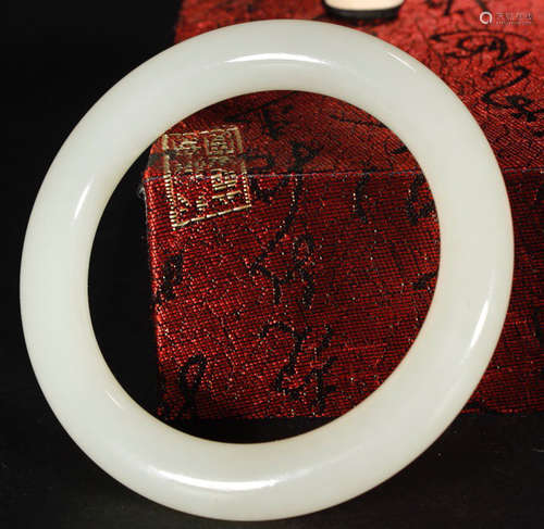 A HETIAN JADE CARVED BANGLE