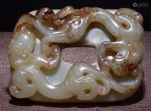 A HETIAN JADE CARVED DRAGON PATTERN BI