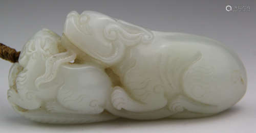 A HETIAN JADE CARVED BEAST SHAPE PENDANT