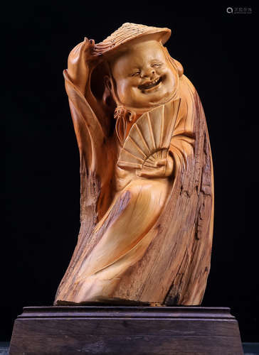 A YABAI WOOD CARVED FIGURE SHAPED ORNAMENT