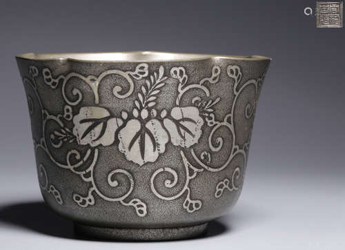 A TIN CASTED FLOWER PATTERN CUP