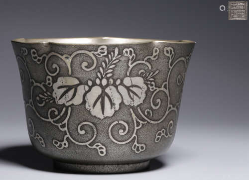 A TIN CASTED FLOWER PATTERN CUP
