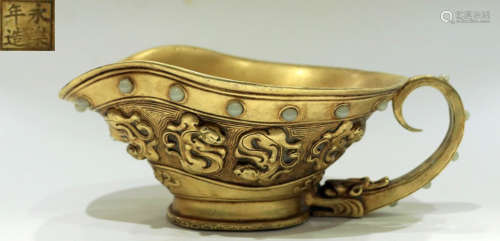 A GILT BRONZE CUP CARVED WITH AUSPICIOUS BEAST