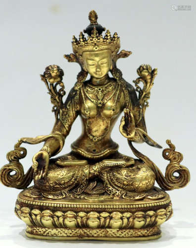 A GILT BRONZE CARVED BUDDHA