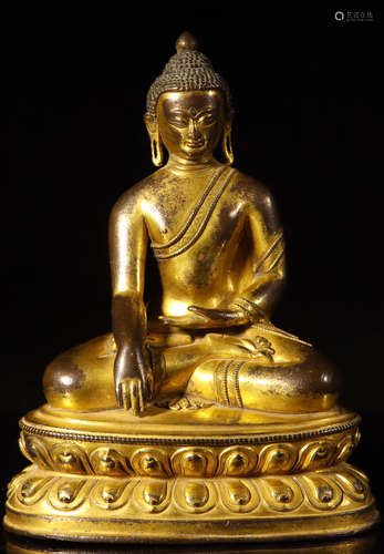 A GILT BRONZE CARVED GAUTAMA BUDDHA