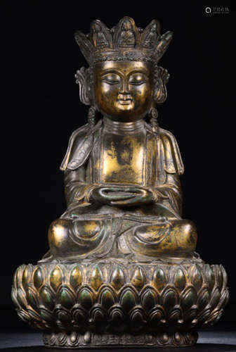 A GILT BRONZE CARVED GAUTAMA BUDDHA